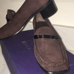 Stuart Wieztman brown suede low loafer pumps.